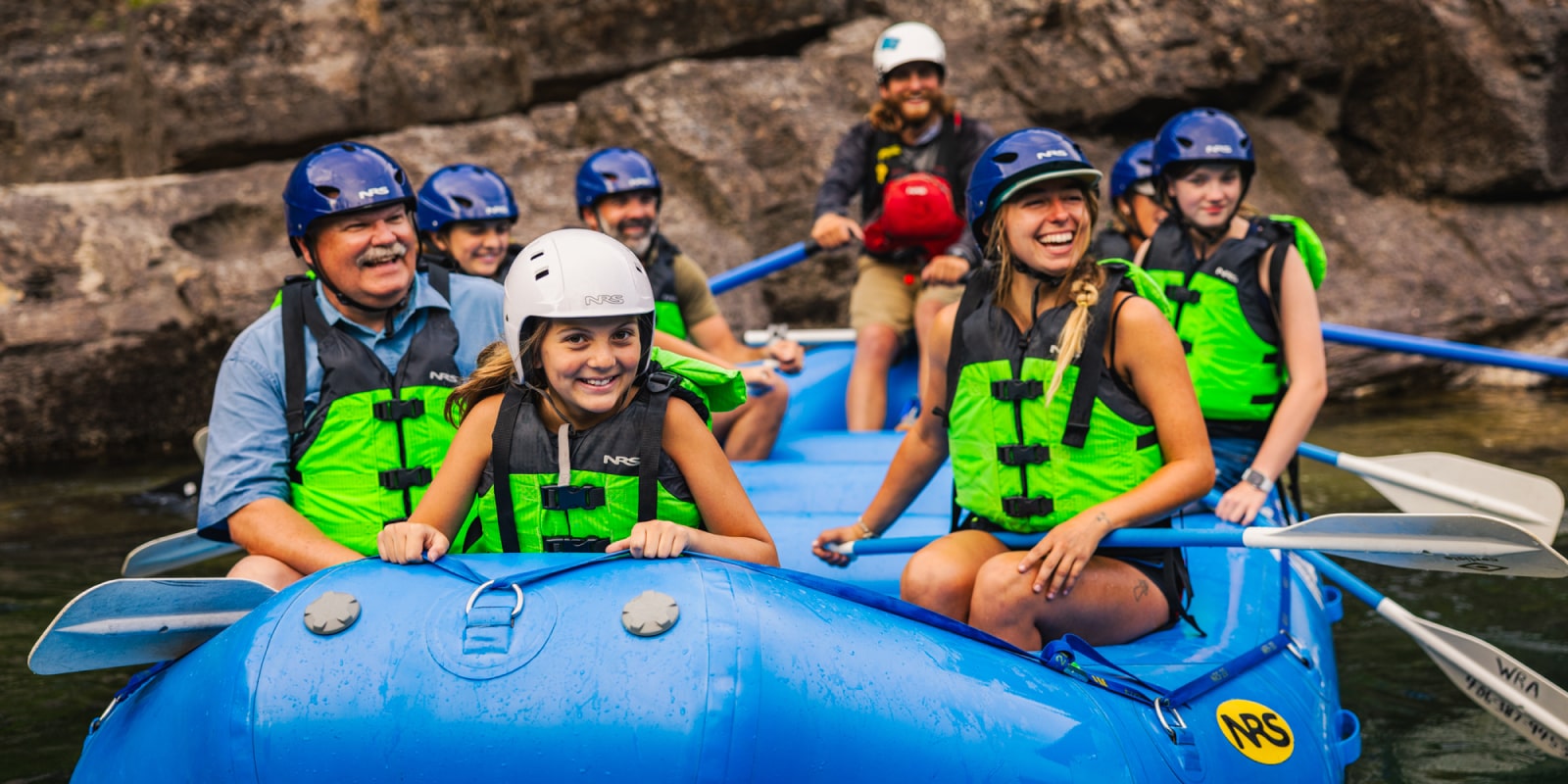 Smiling family on a dinner and rafting trip near Glacier, MT - Wild River