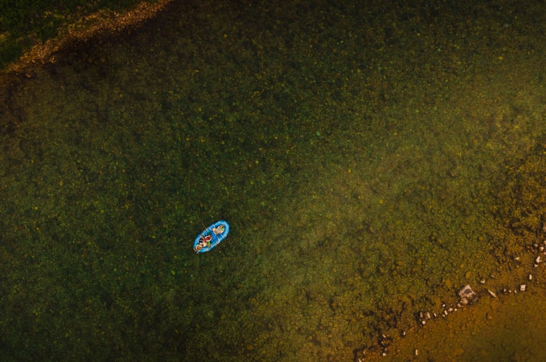 Wild River Adventures boat floating down the Flathead River